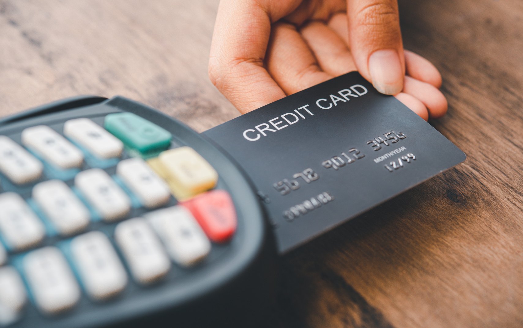 Person Inserting Credit Card into the Terminal 